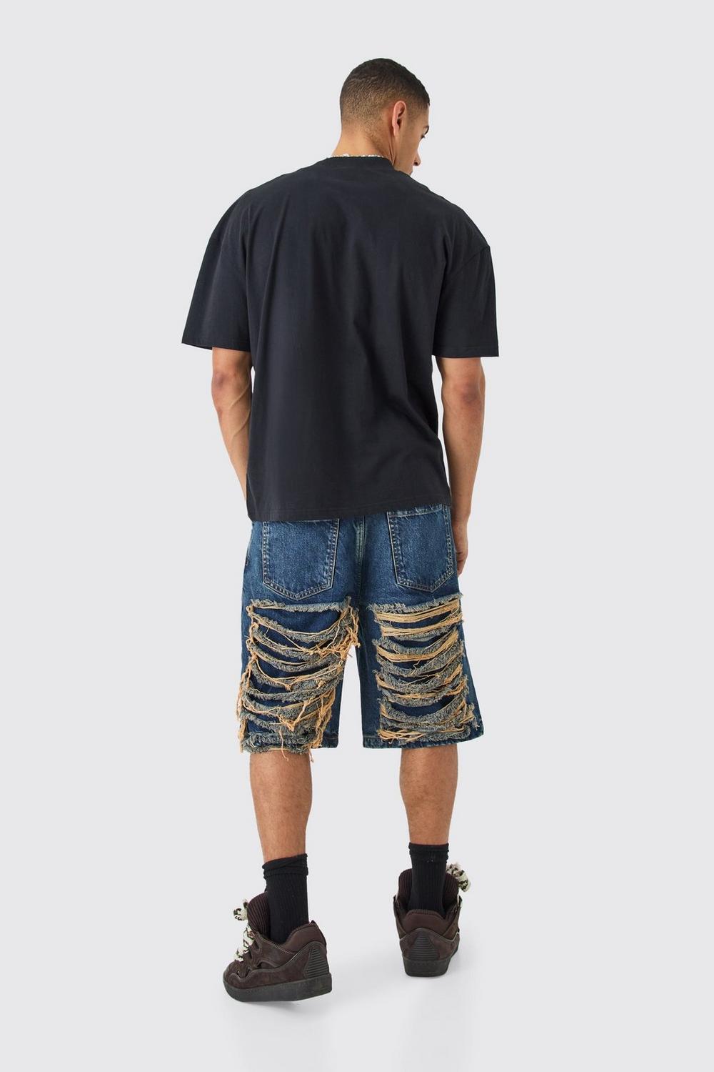 RELAXED RIGID EXTREME RIPPED DENIM JORTS IN ANTIQUE BLUE