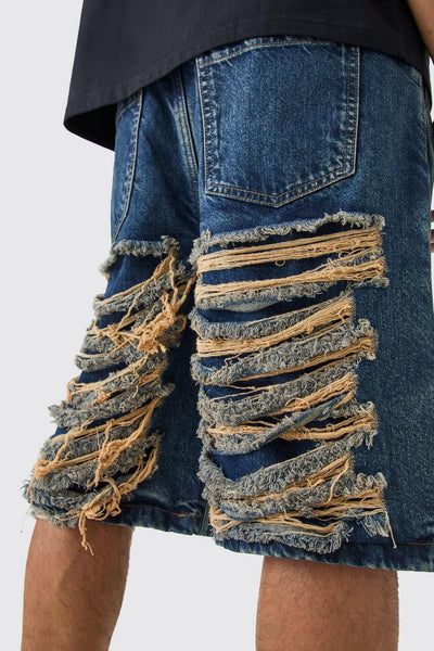 RELAXED RIGID EXTREME RIPPED DENIM JORTS IN ANTIQUE BLUE